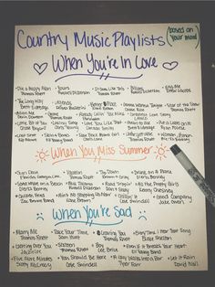 a sheet of paper with writing on it and a pen in front of it that says country music playslists when you're in love