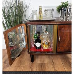 there is a cabinet with liquor bottles in it