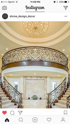 a large foyer with stairs and chandelier