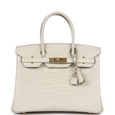 This Birkin is in Beton matte porosus crocodile leather with gold hardware and has tonal stitching, front flap, two straps with center toggle closure, clochette with lock and two keys, and double rolled handles.The interior is lined with Beton chevre and has one zip pocket with an Hermes engraved zipper pull and an open pocket on the opposite side.Collection: UOrigin: FranceCondition: New and never worn (Plastic on hardware) - Scratches to turnlock due to storage.Accompanied by: Hermes box, Hermes dustbag, clochette, lock, two keys, clochette dustbag, rainhat, carebook, CITESMeasurements: 11.75" width x 9.5" height x 6" depth; 4.25" handle drop Birkin Crocodile, Hermes Crocodile, Crocodile Handbags, Birkin 30, Hermes Birkin 25, Hermes Birkin 30, Hermes Box, Birkin 25, Madison Avenue