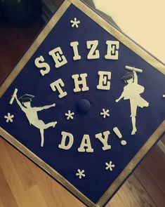 a sign that says, seize the day with dancers in silhouettes on it