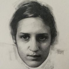 a pencil drawing of a woman's face with dark hair and an eye patch