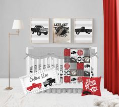 a baby crib bedding set with red and black prints on the wall next to it