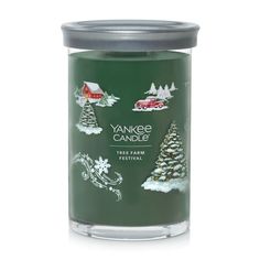 yankee candle tin with christmas trees and snowflakes on the front, in green