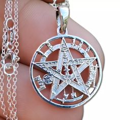 Tetragrammaton Pentagram 925 Silver Pendant 28 mm Inc Bail x 20 mm Magic Angels Wicca Pagan 925 Silver Tetragrammaton Pentacle Amulet Pendant 18" Curb Chain Tetragrammaton amulet pendant in solid 925 Silver. The Tetragrammaton is considered to be one of the most protective and powerful amulets of all time. It is said to include all the names of god within its invocation, and is reputed to be able to dispel all evil and misfortune from its light. This powerful item also invokes the blessing and protection of the angelic trinity - known as the archangels Raphael, Gabriel and Michael. This is a beautiful item, and is also said to have amazing properties, which have been known and revered by those learned in the magical arts for centuries. It is made from solid Silver, and is supplied in a pro Archangels Raphael, Occult Magic, Chain Jewellery, Magical Art, Curb Chain, Chains Jewelry, Silver Pendant, Jewelry Necklace Pendant, 925 Silver