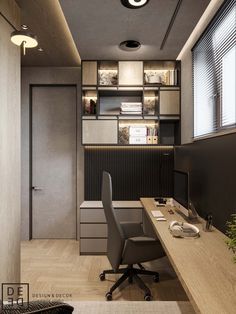 an office with a desk, chair and computer on top of the desk is lit by recessed lights