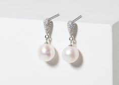 "Dainty pearl bridal earrings with crystal teardrop stud.  Pearls are an elegant and timeless choice to compliment any wedding look. The diameter of the pearl is 7mm. Our jewellery is all crafted from high quality 925 sterling silver, it contains no brass, nickel or any other metals meaning no skin irritation on your wedding day and can be passed down to future generations.  Swarovski pearls are vegan friendly as they aren't produced inside an oyster! Instead, they're referred to as \"simulated Formal Teardrop Bridal Earrings With Pearls, Classic Teardrop Bridal Earrings For Mother Of The Bride, Elegant Round Teardrop Earrings For Wedding, Pearl Bridal Earrings, Wedding Day Jewelry, Pearl Bridal Jewelry, Bridal Earrings Pearl, Wedding Look, Pearl Bridal