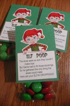 three elf pop candy bags sitting on top of a wooden table