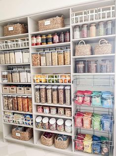 an organized pantry with baskets and food items