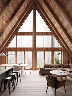 a living room filled with lots of furniture and large windows covered in wooden shingles