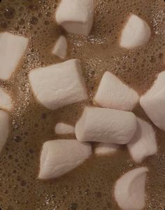 cubes of marshmallows are being cooked in a hot pot with oil