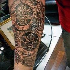 a man's arm with a clock tattoo on the inside of it, and an intricate design