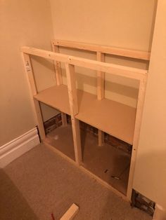 an unfinished shelf in the corner of a room