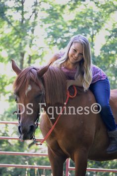 a woman riding on the back of a brown horse