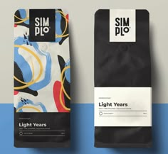 two coffee bags sitting next to each other