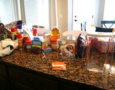 the kitchen counter is cluttered with food and condiments