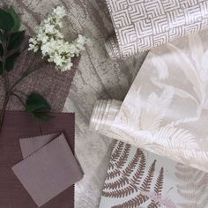 some white flowers and fabric on a table