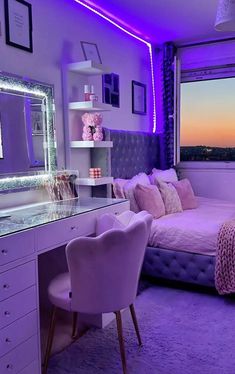 a bedroom with purple lighting and a large mirror on the wall above the bed is lit up by pink lights