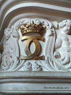 a crown on top of a white mantle