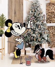 a christmas tree is decorated with mickey mouse and other holiday decorations, including candy canes