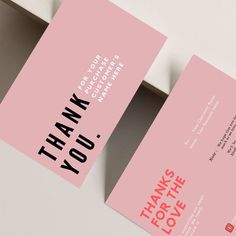 two pink business cards with the words thank you written in black and red on them