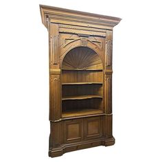 an antique wooden bookcase with carved details