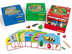 an assortment of children's learning games including cards, magnets and pencils