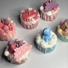 there are many cupcakes that have been decorated with fondant and icing