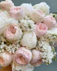 a bridal bouquet with pink and white flowers