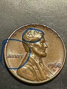 an image of a penny with the word liberty on it's side and a blue marker