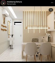 a dining room with chairs and a table in front of a white kitchen counter top