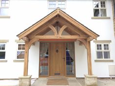 a white house with a wooden front door