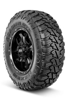 an all terrain truck tire on a white background