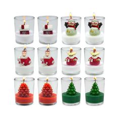 twelve christmas candles in glass holders with santa