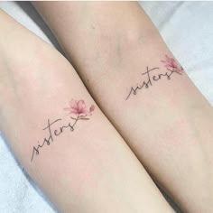 two matching tattoos with the words sisters and lotuses on their legs, both written in cursive handwriting