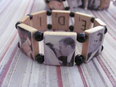 a wooden bracelet with two pictures on it