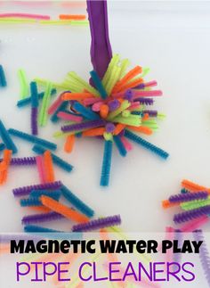 this is an image of a plastic water play with colored straws and a purple toothbrush