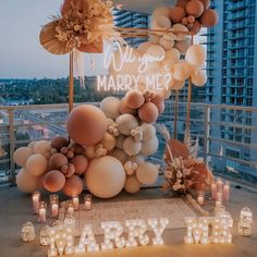 a large balloon arch decorated with balloons and lights