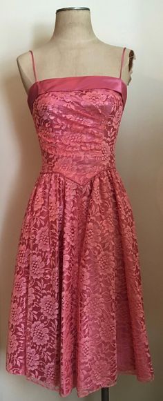 "Beautifully feminine pink lace & satin party dress with basque waist and ruching is a custom made creation from the 1980's. Dress has spaghetti straps, zips up in the back and is lined in satin. Dress is in excellent condition. Chest 32\"-34\" Waist 26\" Hips 44\" plus Length from armpit to hem 35\" All vintage is sold in \"as-is\" condition. We do our best to inspect, correct, and list important flaws. All measurements are made with the garment laying flat. Length is measured from shoulder 1980s Party Dress, Pink Lace Dress With Fitted Bodice, Pink Lace Cocktail Dress, Pink Lace Dress For Prom Season, Pink Lace Dress With Lace Bodice For Party, Pink Lace Dress With Lace Bodice For Prom, Pink Lace Bodice Dress For Party, Formal Pink Lace Dress With Lace Bodice, Pink Lace Bodice Dress For Prom