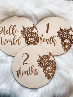 three wooden coasters with the names of two month's worthies on them