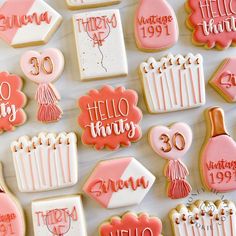 decorated cookies are arranged on a table for someone's 30th birthday party or special occasion