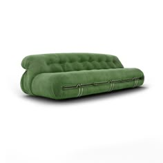 a green couch sitting on top of a white floor