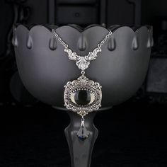 "💀 DESCRIPTION: This y necklace features a large vintage oval cabochon, in Black Diamond, that was hand set into a crown edge setting and layered onto ornate stampings with floral and flourish details. A faceted crystal pendant from Swarovski® dangles from the bottom. The entire ensemble dangles from beautiful Rococo style connector. The cable chain was finished with a lobster clasp and an extender. 💀 SIZE & MATERIALS: The vintage glass cabochon was made from glass in the 1970's and is from We Victorian Style Jewelry, Jewel Necklace, Y Necklace, Gem Necklace, Glass Gems, Rococo Style, Necklace Statement, Gift For Girlfriend, Faceted Crystal