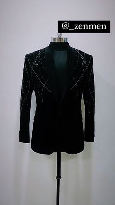 a mannequin wearing a tuxedo and jacket with sequins on it