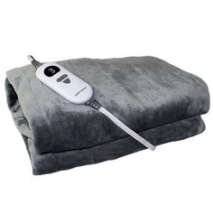 an electric blanket with a remote control on it