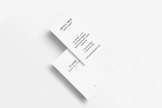 two white business cards on top of each other