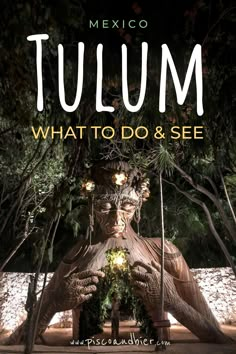 a statue with the words tulmm on it and an image of a man's face surrounded by trees