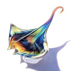 a colorful glass object sitting on top of a table