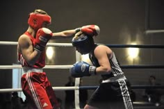 two men in red and white boxing gloves