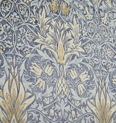 an ornate blue and gold wallpaper with flowers